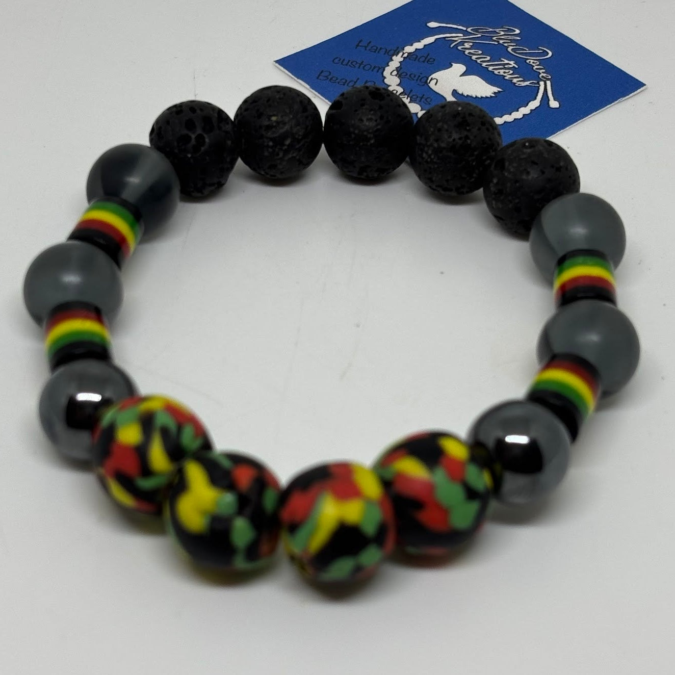 Black beaded bracelet with Rasta pattern on a white background