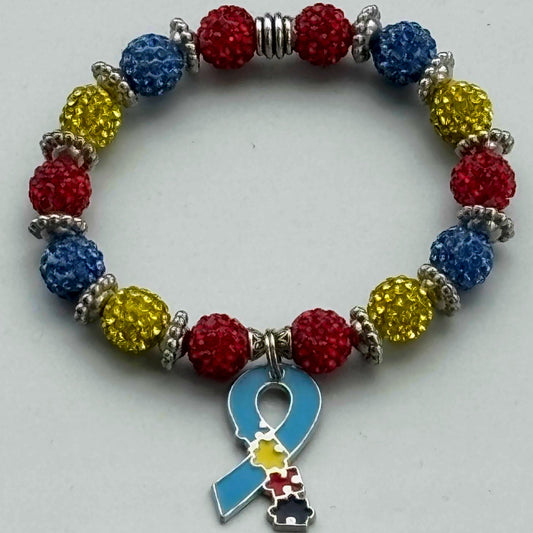 Colorful beaded bracelet with a blue ribbon charm on a gray background