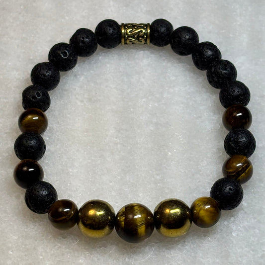 Beaded bracelet with black and brown beads on a textured white background