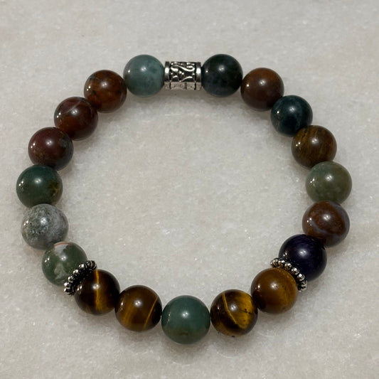 Multicolored beaded bracelet on a light gray background